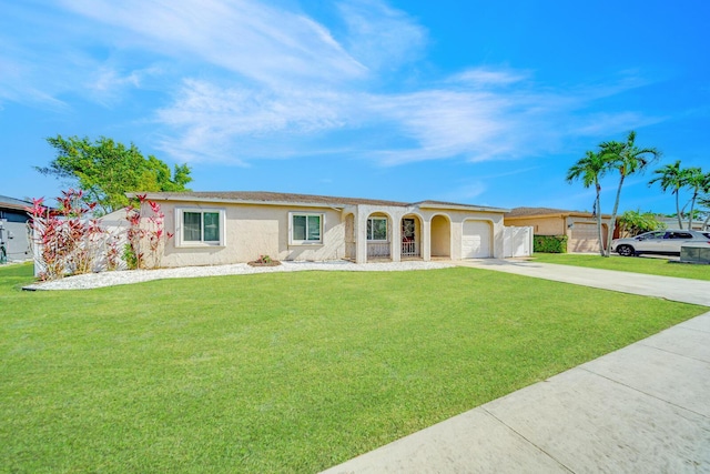 ranch-style house with a garage and a front lawn