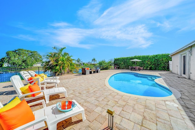 view of swimming pool featuring a patio area