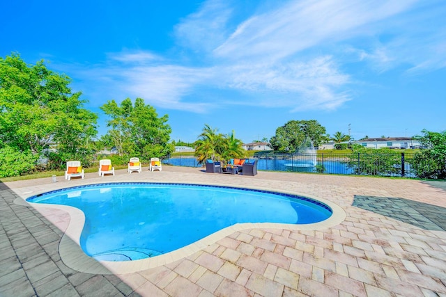 view of swimming pool featuring a water view, an outdoor hangout area, and a patio area