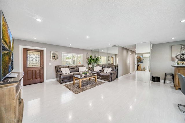 living room featuring a textured ceiling