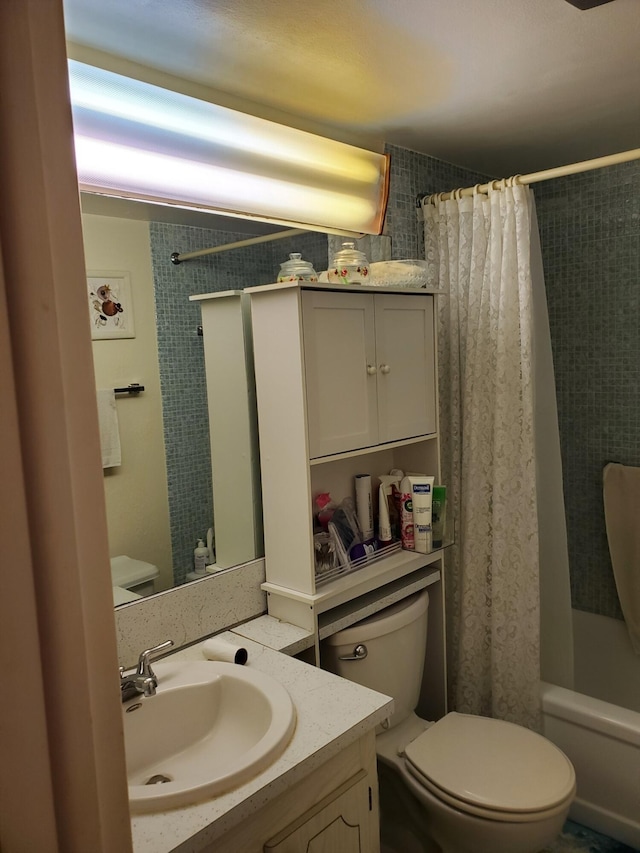 full bathroom with shower / bath combo, toilet, and vanity