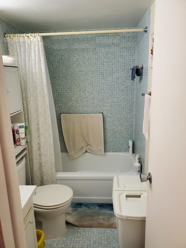 full bathroom with shower / bath combo, vanity, toilet, and tile patterned floors