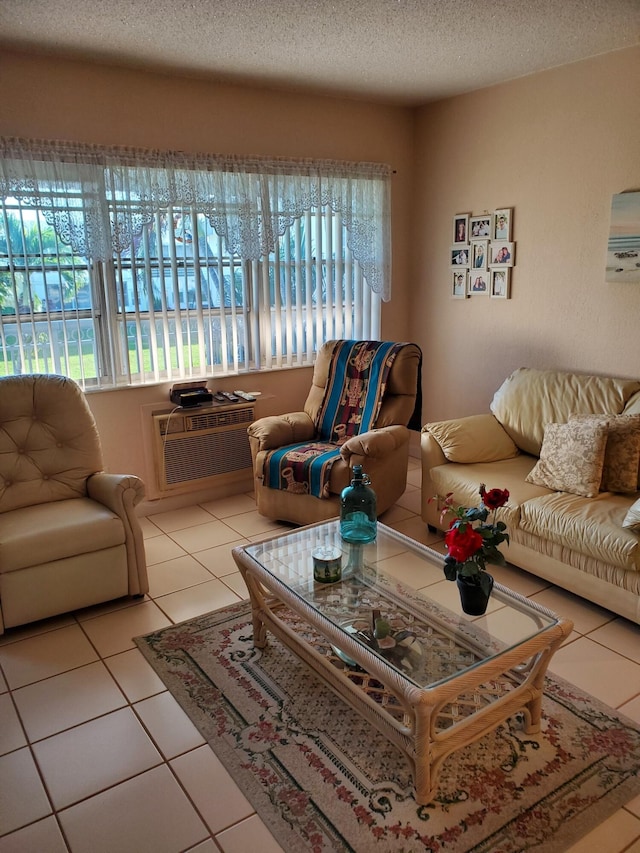 tiled living room with an AC wall unit and a textured ceiling