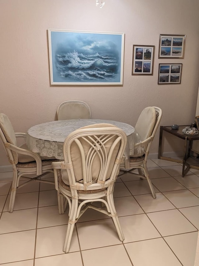 dining space featuring tile patterned flooring