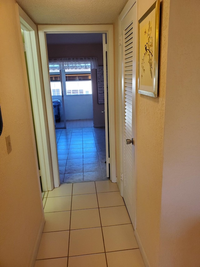 hallway featuring light tile patterned flooring