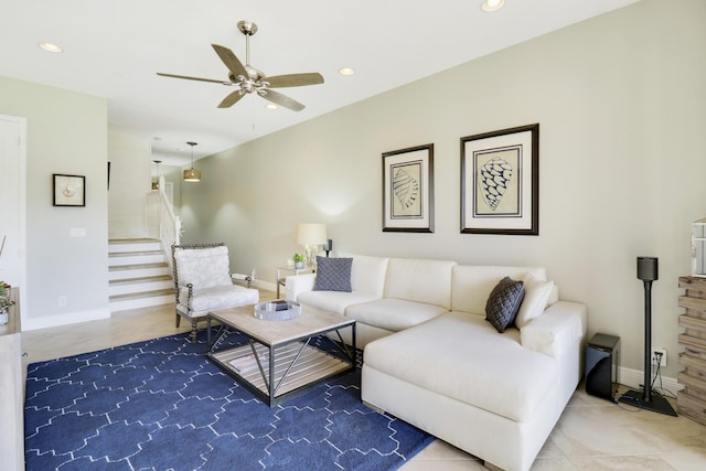 living room featuring ceiling fan and tile patterned flooring