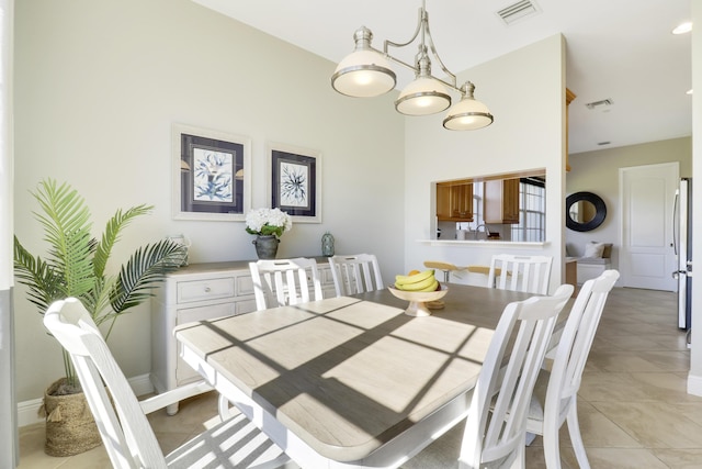 dining area featuring light tile patterned floors