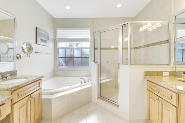 bathroom with tile patterned flooring, vanity, and separate shower and tub