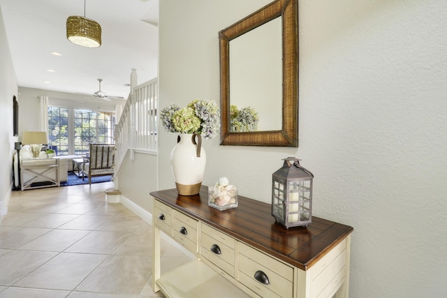 hall with light tile patterned floors