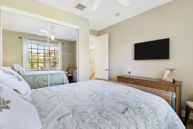 bedroom with ceiling fan and a closet