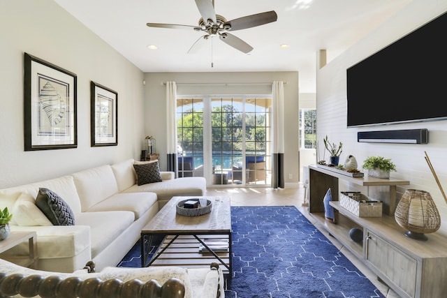 tiled living room featuring ceiling fan