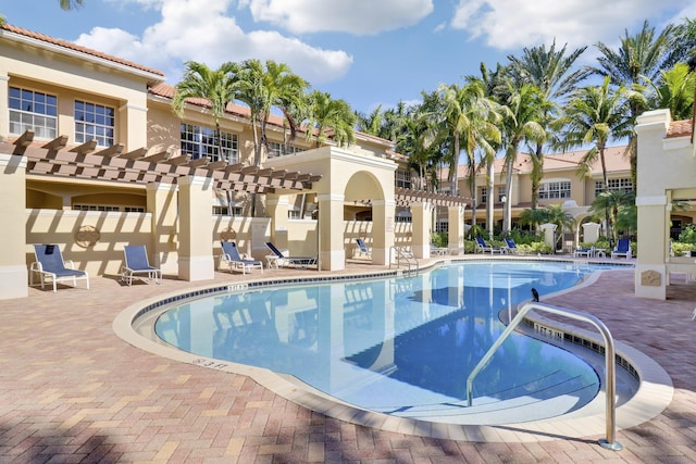 view of pool with a patio area and a pergola