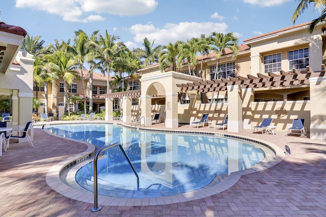 view of pool featuring a pergola and a patio area