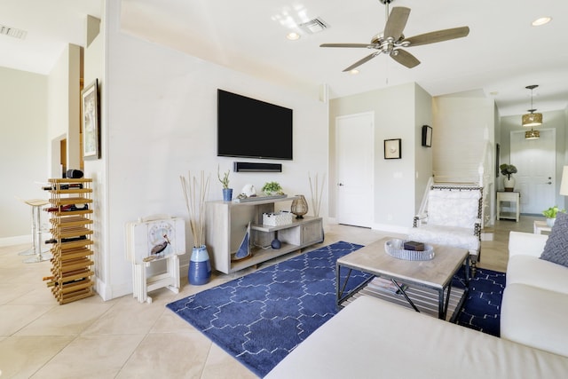 tiled living room featuring ceiling fan