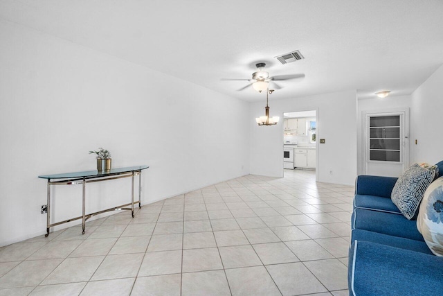 living room with ceiling fan and light tile patterned flooring