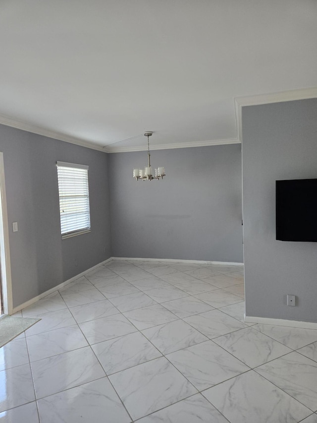 empty room featuring ornamental molding and a chandelier