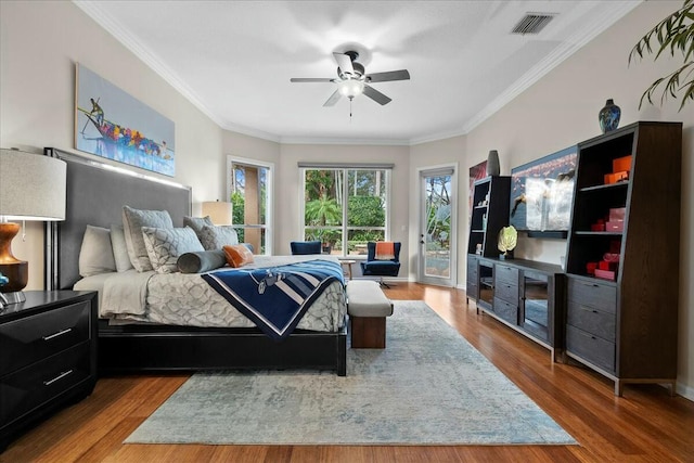 bedroom with hardwood / wood-style floors, ceiling fan, crown molding, and access to outside