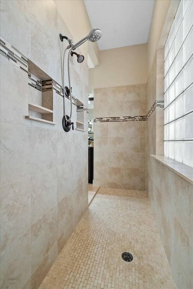 bathroom with tiled shower