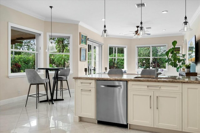 kitchen featuring ceiling fan, sink, decorative light fixtures, stone counters, and dishwasher