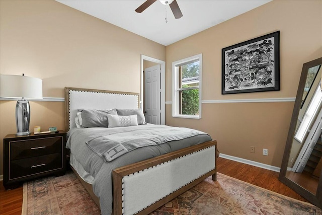 bedroom with ceiling fan and wood-type flooring