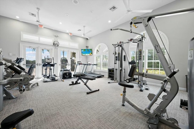 gym with ceiling fan, carpet floors, and lofted ceiling