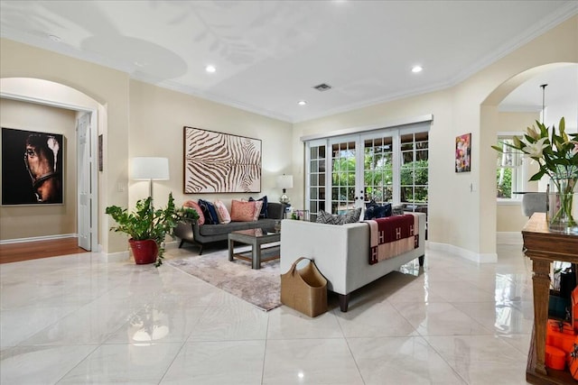 living room featuring french doors and crown molding