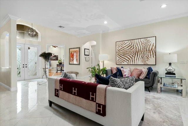 living room featuring ornamental molding and french doors