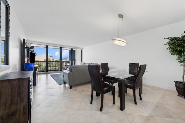 4748 S Ocean Blvd Unit 306, Highland Beach, FL 33487 - dining space featuring expansive windows and light tile patterned flooring