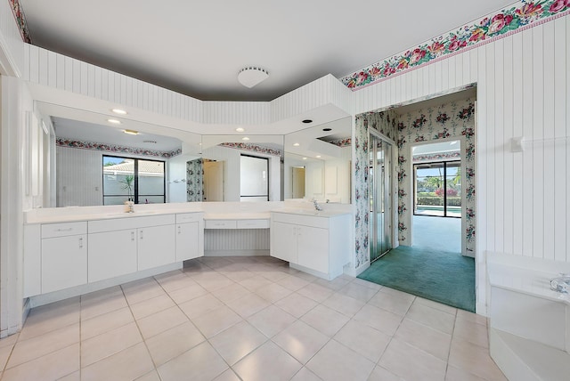 bathroom featuring vanity, tile patterned flooring, and walk in shower