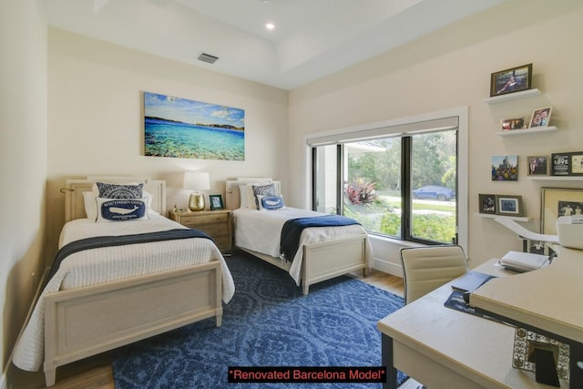 bedroom with dark hardwood / wood-style floors