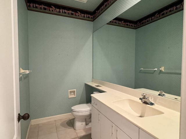 bathroom featuring tile patterned floors, vanity, and toilet