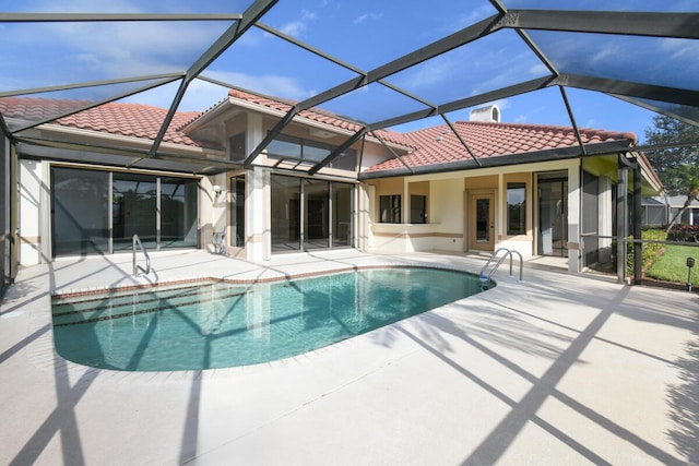 view of swimming pool with a patio and a lanai