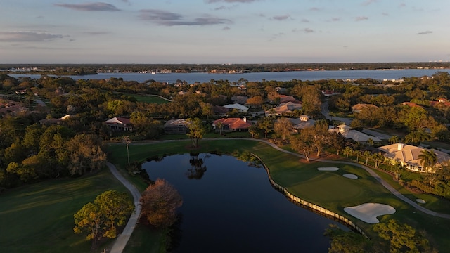 aerial view at dusk with a water view