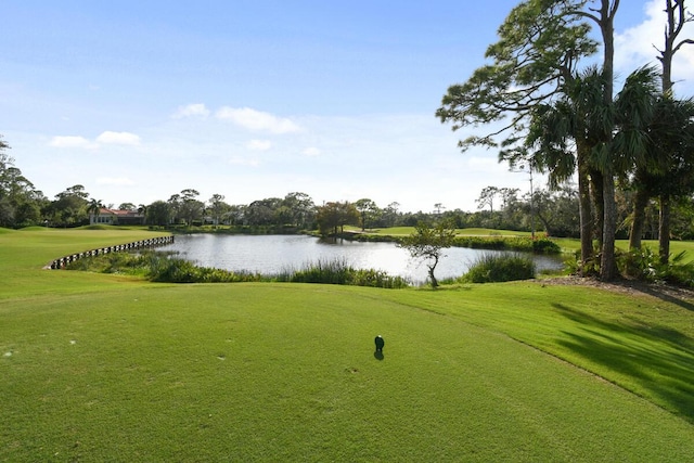 surrounding community featuring a yard and a water view