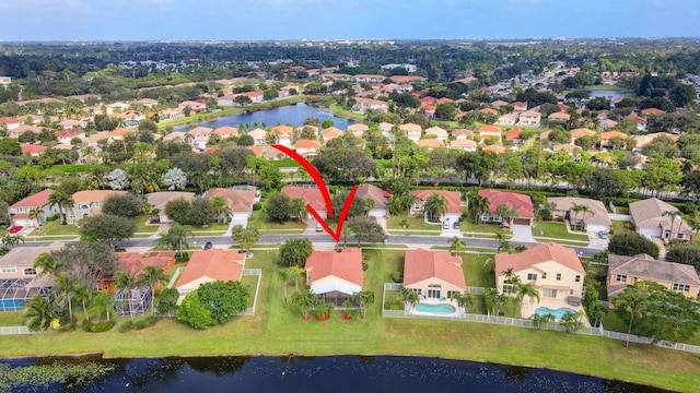 birds eye view of property with a water view