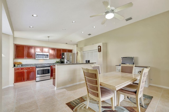 tiled dining room with ceiling fan and vaulted ceiling