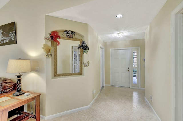 foyer entrance featuring light tile patterned floors