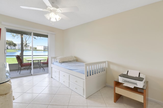 tiled bedroom with access to outside, a water view, and ceiling fan