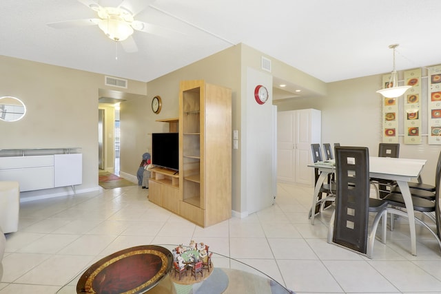 interior space featuring light tile patterned floors and ceiling fan