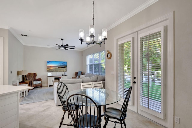 dining area with ceiling fan with notable chandelier and ornamental molding