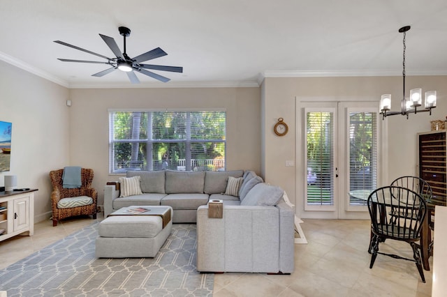 living room featuring ceiling fan with notable chandelier and ornamental molding