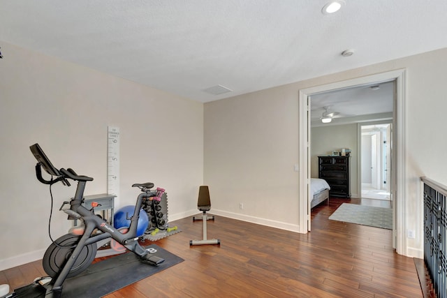 workout room with dark hardwood / wood-style floors