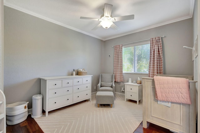 bedroom featuring light hardwood / wood-style floors, ceiling fan, and ornamental molding