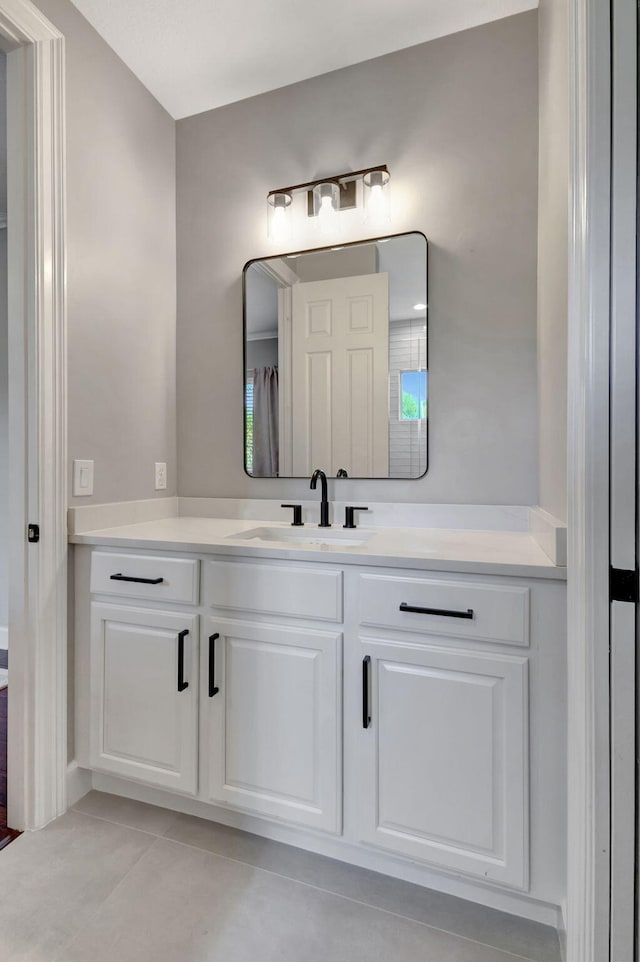 bathroom featuring tile patterned floors and vanity