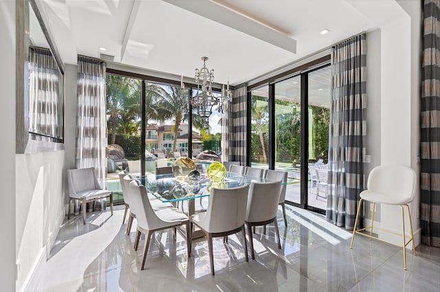 dining room featuring floor to ceiling windows and an inviting chandelier