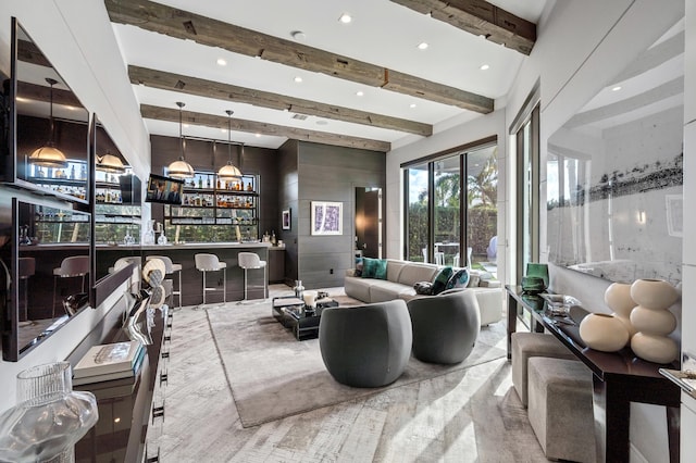 living room featuring beamed ceiling and indoor bar