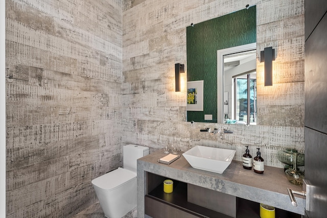 bathroom featuring backsplash, vanity, and toilet