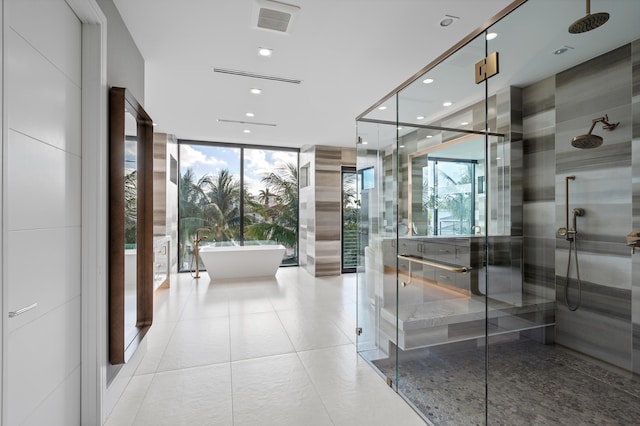 interior space with a wall of windows, tile patterned flooring, and shower with separate bathtub