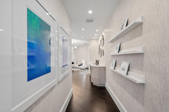 corridor with dark hardwood / wood-style floors