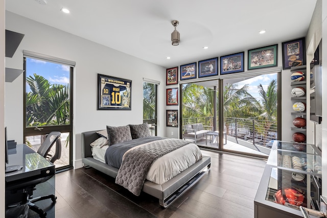 bedroom with access to exterior, ceiling fan, and dark hardwood / wood-style flooring